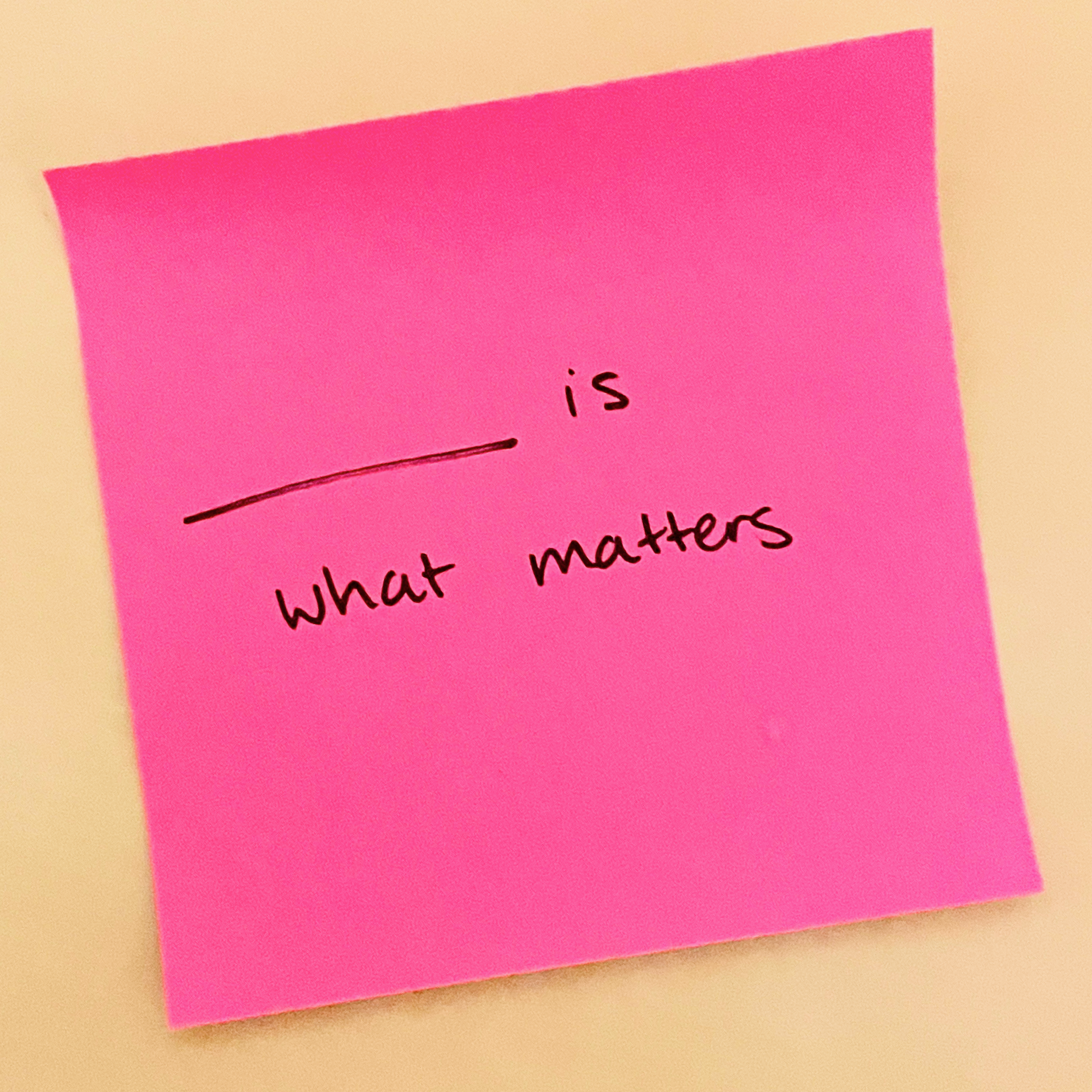 A small piece of paper with 'blank is what matters' written on it.